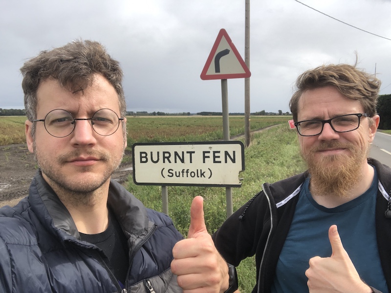 Me standing in front of a burnt fen sign with Steve